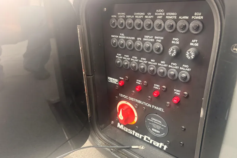 Slide: The Image of 2019 MasterCraft XStar control panel with various switches and indicators. - 22
