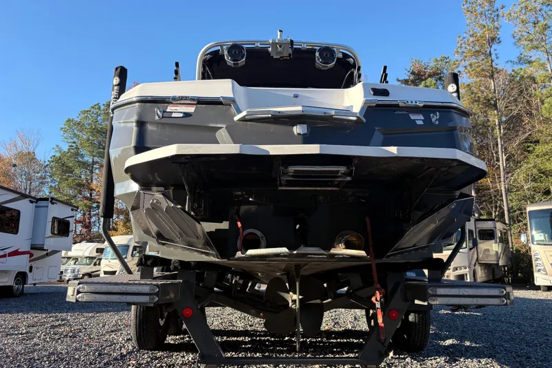 Slide: The Image of 2019 MasterCraft XStar boat on trailer, rear view, parked outdoors. - 3