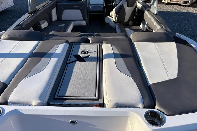 Slide: The Image of 2019 MasterCraft XStar boat interior with sleek seating and modern design. - 6
