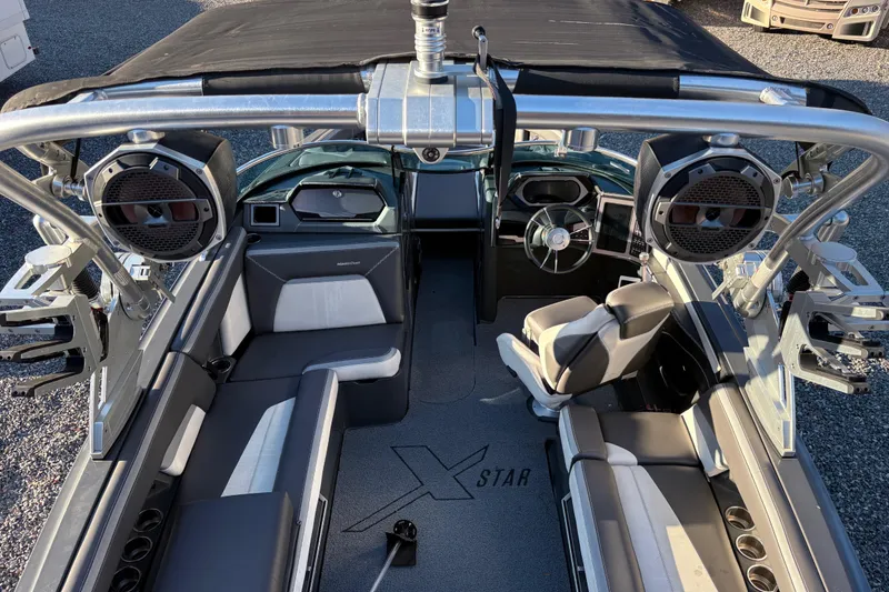 Slide: The Image of 2019 MasterCraft XStar boat interior with premium seating and advanced audio system. - 7