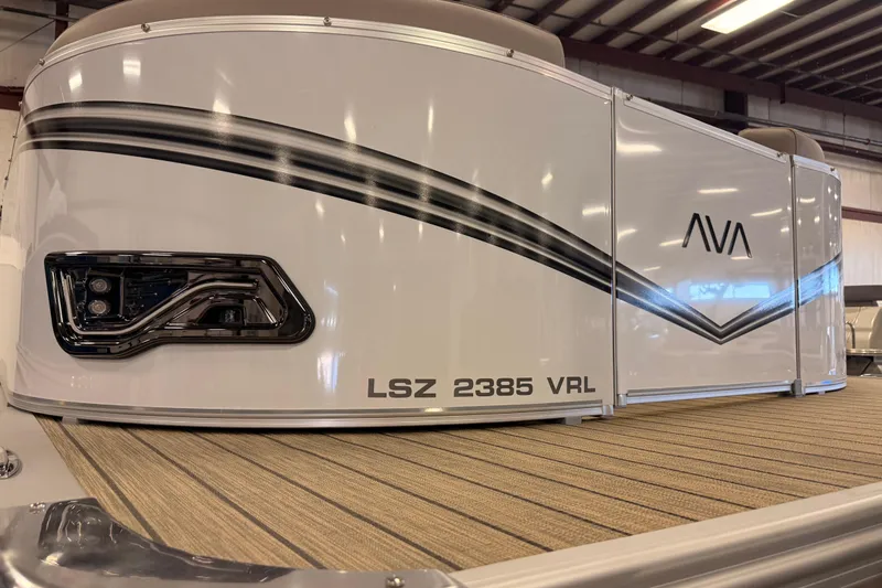 Slide: The Image of 2025 Avalon LSZ Versatile Rear Lounge pontoon boat with sleek design in showroom. - 7