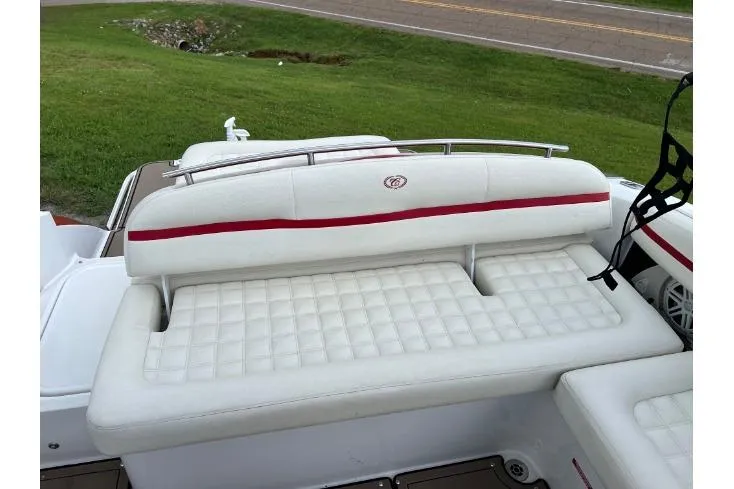 Slide: The Image of 2018 Cobalt R5 Surf boat with white cushioned seating and red accents. - 13