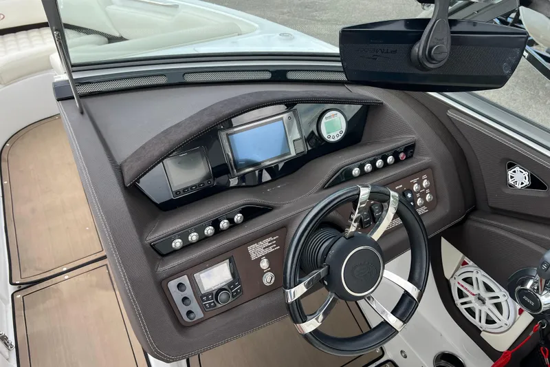 Slide: The Image of 2018 Cobalt R5 Surf boat dashboard with steering wheel and control panel. - 19