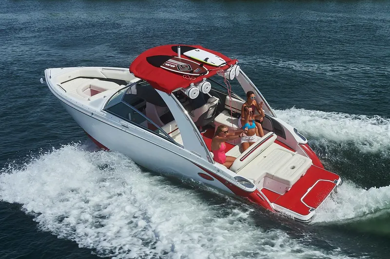 Slide: The Image of Manufacturer Provided Image: 2018 Cobalt R5 Surf boat cruising on water with passengers. - 2