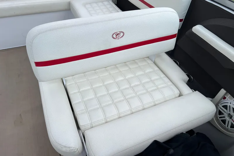 Slide: The Image of 2018 Cobalt R5 Surf boat seat with white upholstery and red accents. - 21