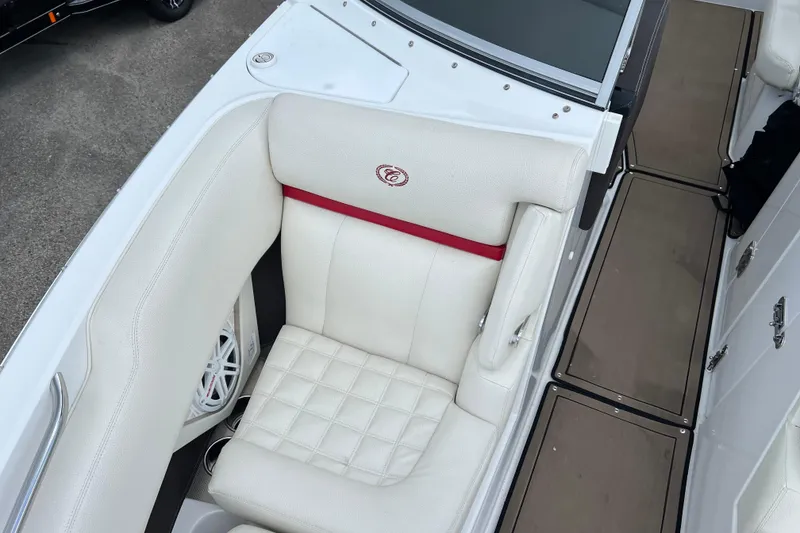 Slide: The Image of 2018 Cobalt R5 Surf boat interior with white cushioned seating and red accent. - 23
