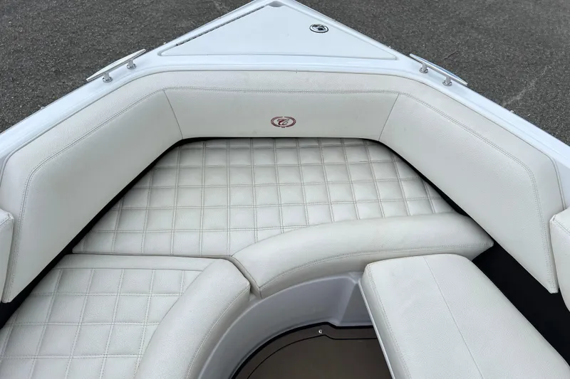 Slide: The Image of 2018 Cobalt R5 Surf boat interior with white cushioned seating. - 24