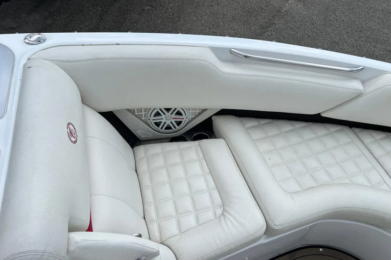 Slide: The Image of Luxurious white seating on a 2018 Cobalt R5 Surf boat interior. - 25