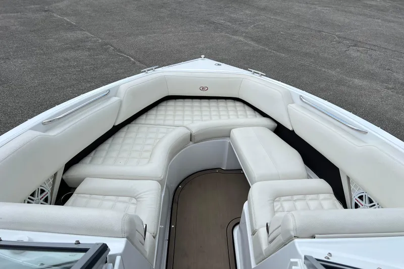 Slide: The Image of 2018 Cobalt R5 Surf boat with luxurious white seating and spacious interior. - 26