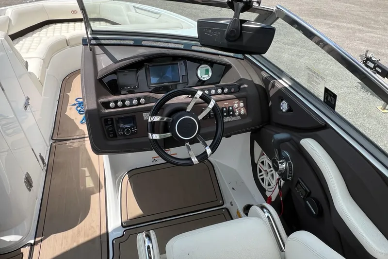 Slide: The Image of 2018 Cobalt R5 Surf boat cockpit with modern controls and steering wheel. - 27