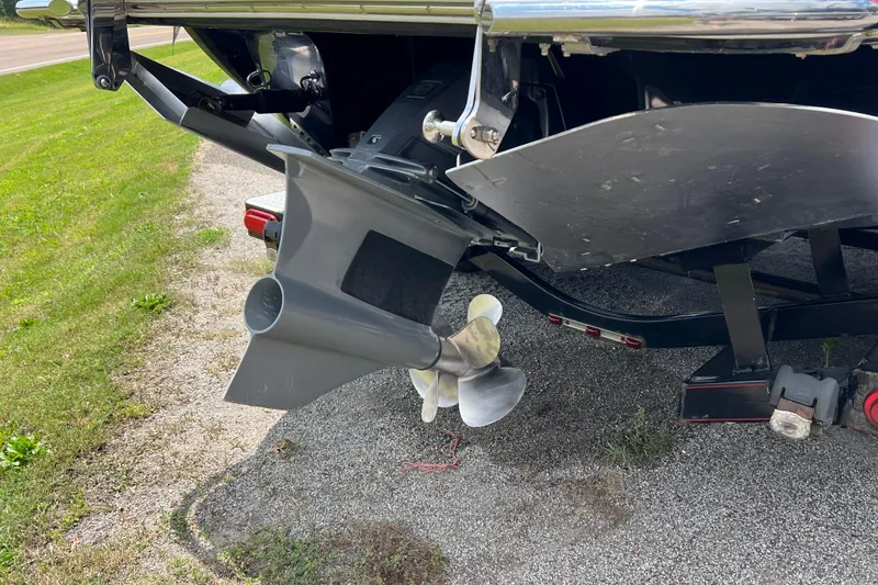 Slide: The Image of Rear view of a 2018 Cobalt R5 Surf boat's propeller and rudder on a trailer. - 28