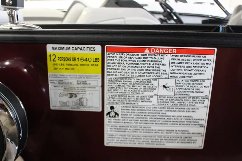 Slide: The Image of 2024 Sylvan Mirage X X3 capacity and safety warning labels, 12-person or 1640 lbs limit. - 11