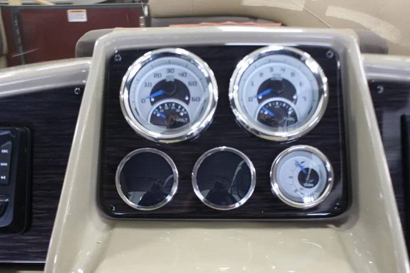 Slide: The Image of Dashboard of 2024 Sylvan Mirage X X3 boat with gauges and controls. - 13