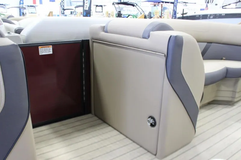 Slide: The Image of 2024 Sylvan Mirage X X3 pontoon boat interior with beige and gray seating. - 15