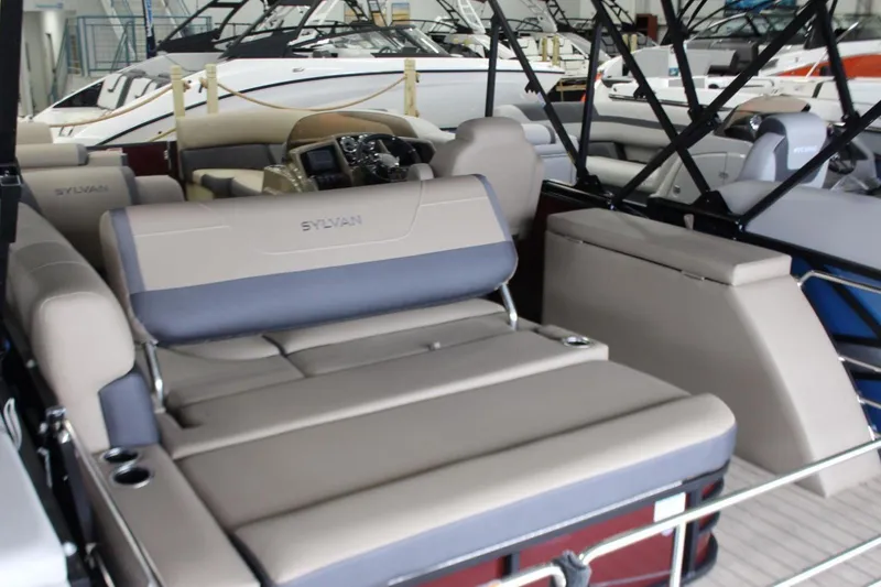 Slide: The Image of 2024 Sylvan Mirage X X3 pontoon boat interior with luxurious seating and modern design. - 5