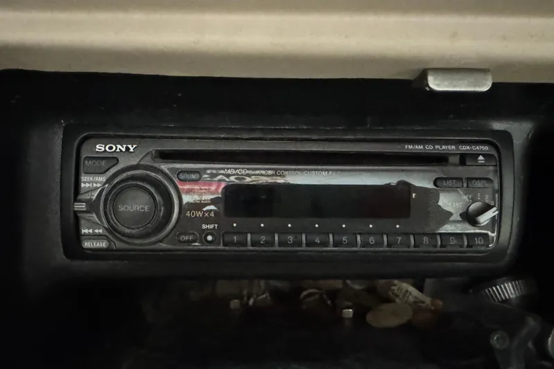 Slide: The Image of Sony CD player in a 2000 Bryant 214 Walk Through boat dashboard. - 12