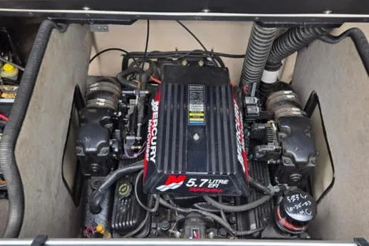 Slide: The Image of Engine compartment of a 2000 Bryant 214 Walk Through boat with a 5.7L Mercury engine. - 14