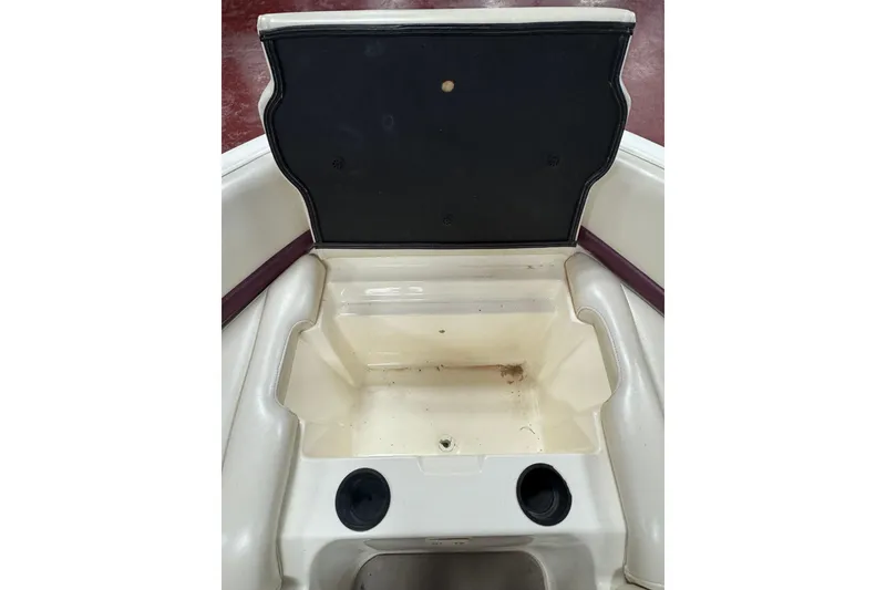 Slide: The Image of Open storage compartment in a 2000 Bryant 214 Walk Through boat. - 8