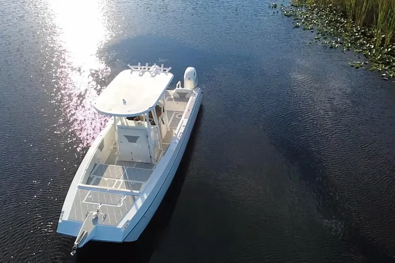 Slide: The Image of Aerial view of 1997 Sea Cat SL5 Cat boat on calm water. - 11