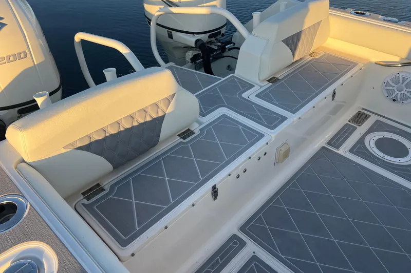 Slide: The Image of 1997 Sea Cat SL5 Cat boat interior with cushioned seating and deck details. - 16