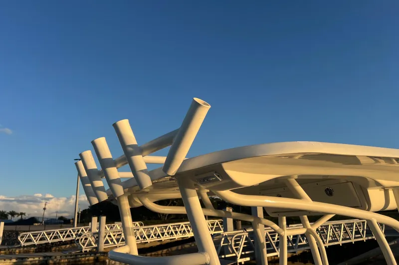 Slide: The Image of 1997 Sea Cat SL5 Cat boat structure against clear blue sky. - 24