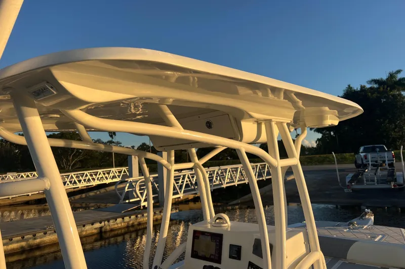 Slide: The Image of 1997 Sea Cat SL5 Cat boat with T-top at marina during sunset. - 26