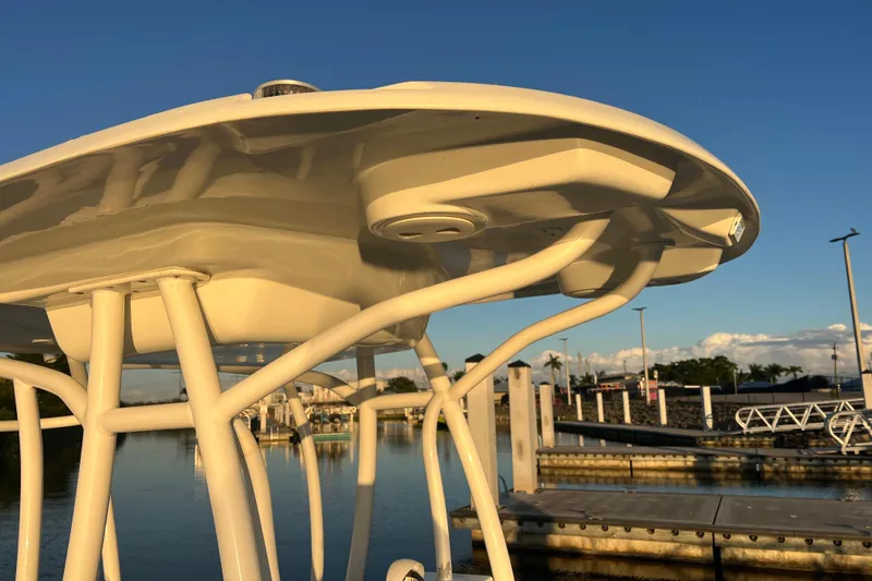 Slide: The Image of 1997 Sea Cat SL5 Cat boat detail at marina, under clear blue sky. - 25