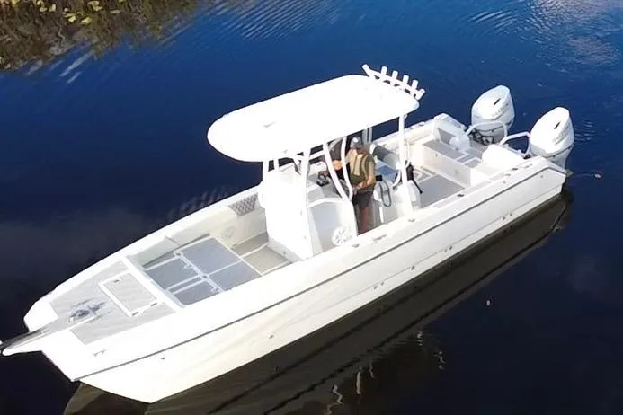 Slide: The Image of 1997 Sea Cat SL5 Cat boat on calm water, featuring dual engines and a white canopy. - 3