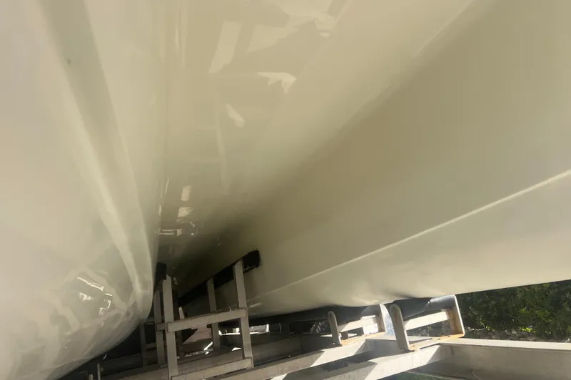 Slide: The Image of 1997 Sea Cat SL5 Cat boat hull on trailer, close-up view. - 34