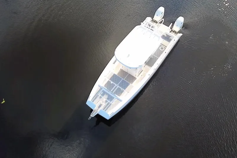 Slide: The Image of Aerial view of 1997 Sea Cat SL5 Cat boat on calm water. - 9