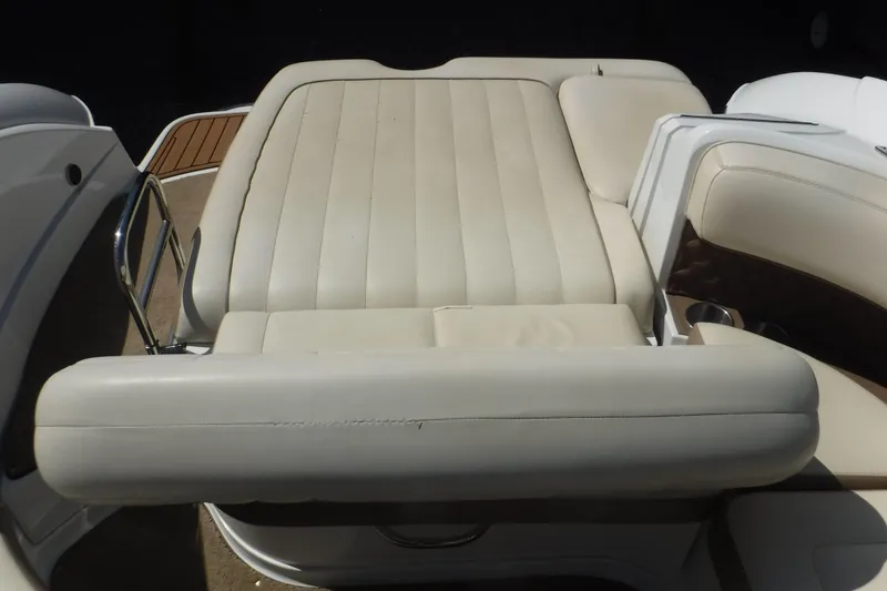 Slide: The Image of 2010 Cobalt 242 boat with beige leather seating and stainless steel accents. - 10