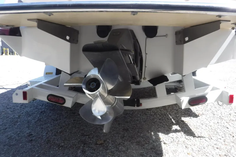 Slide: The Image of Rear view of 2010 Cobalt 242 boat with propeller and trailer. - 20