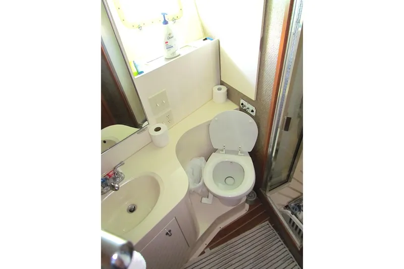 Slide: The Image of Bathroom of 1992 Hatteras 40 Motor Yacht with sink, toilet, and shower. - 16