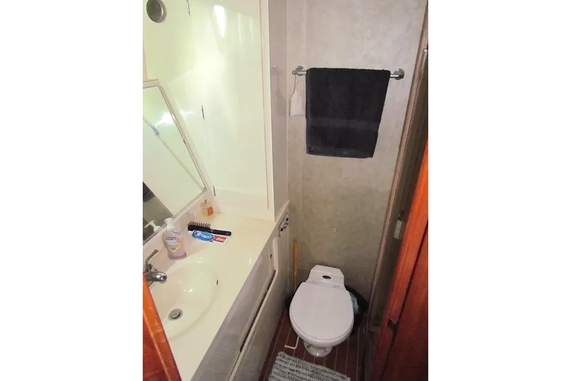 Slide: The Image of Bathroom interior of 1992 Hatteras 40 Motor Yacht with sink and toilet. - 20