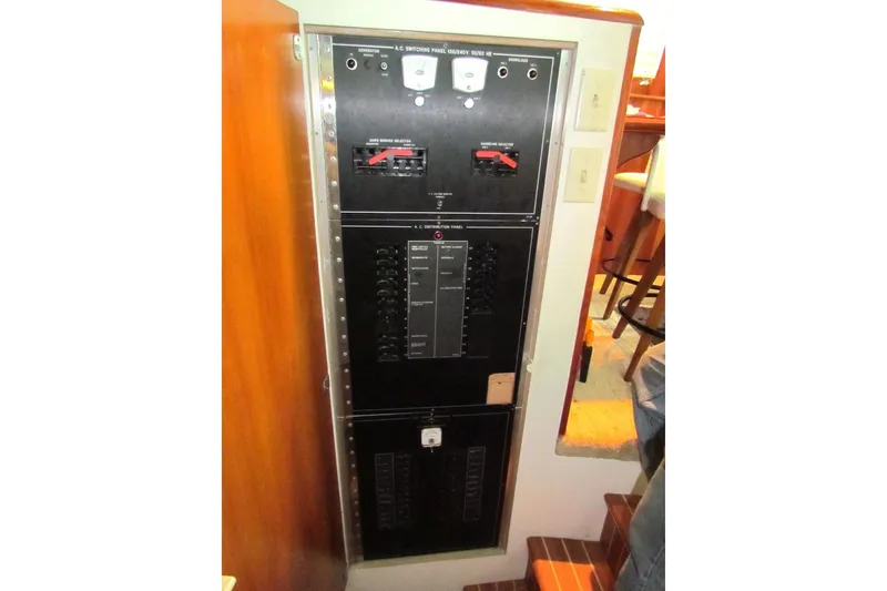 Slide: The Image of Electrical panel on a 1992 Hatteras 40 Motor Yacht, featuring switches and controls. - 22
