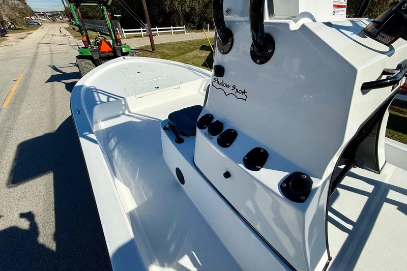 Slide: The Image of 2026 Shallow Sport 24 Sport boat on trailer, side view, sunny day. - 13