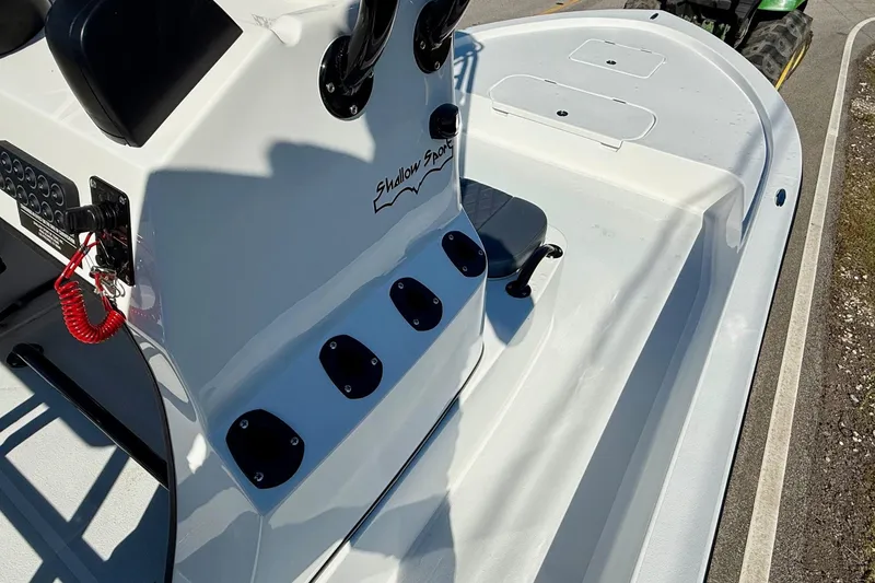 Slide: The Image of 2026 Shallow Sport 24 Sport boat interior with console and seating. - 15