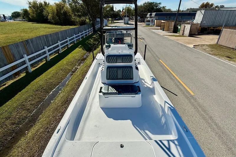 Slide: The Image of 2026 Shallow Sport 24 Sport boat on trailer, side view, sunny day. - 16