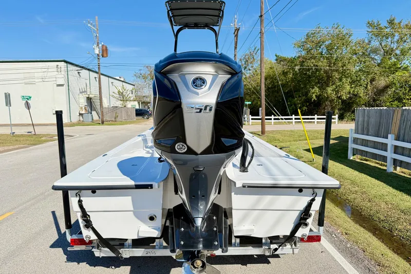 Slide: The Image of 2026 Shallow Sport 24 Sport boat with powerful outboard motor on trailer. - 3