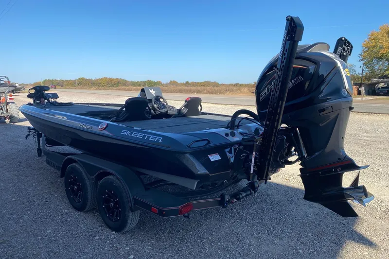 Slide: The Image of 2026 Skeeter ZXE20 boat with powerful outboard motor on a trailer. - 5