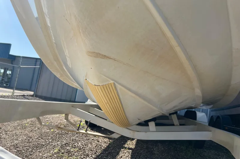 Slide: The Image of 2008 Cobalt 252 boat hull on trailer, showing underside and protective strip. - 19