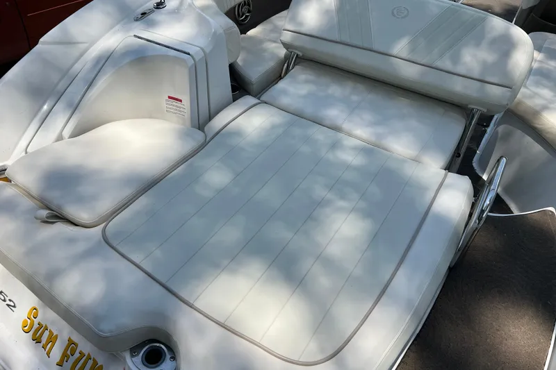 Slide: The Image of 2008 Cobalt 252 boat with white cushioned seating and sunbathing area. - 6