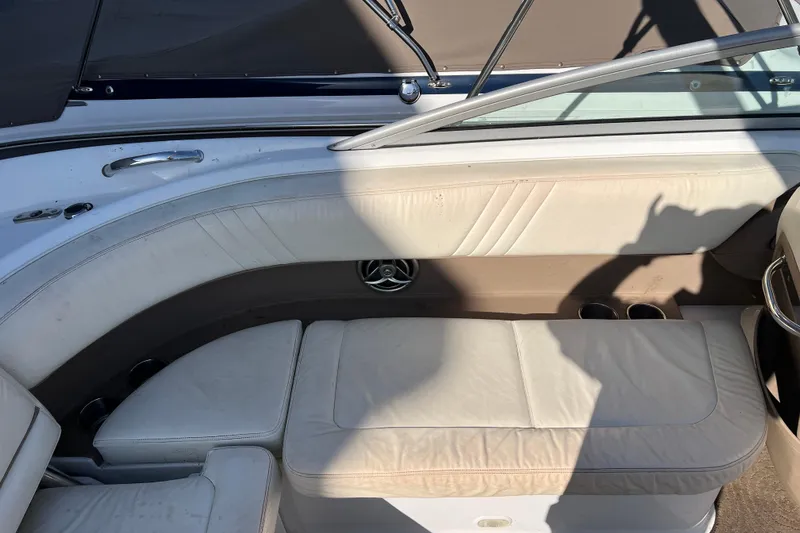 Slide: The Image of Interior of a 2008 Cobalt 252 boat with white leather seating. - 9