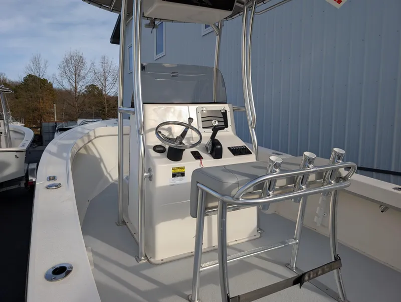 Slide: The Image of 2024 May-Craft 20 Cape Classic boat interior with steering console and seating. - 12