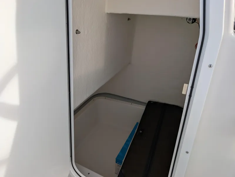 Slide: The Image of 2024 May-Craft 20 Cape Classic storage compartment interior view. - 13