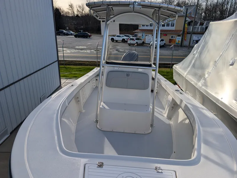 Slide: The Image of 2024 May-Craft 20 Cape Classic boat with T-top, docked outdoors. - 8
