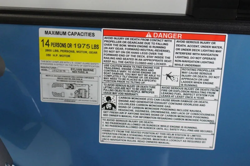 Slide: The Image of Warning label on 2025 Sylvan L5 CLZ DH boat, detailing capacity and safety instructions. - 10