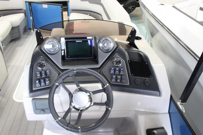 Slide: The Image of 2025 Sylvan L5 CLZ DH boat dashboard with steering wheel and control panel. - 11