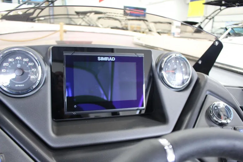 Slide: The Image of Dashboard of 2025 Sylvan L5 CLZ DH boat with Simrad display and gauges. - 19