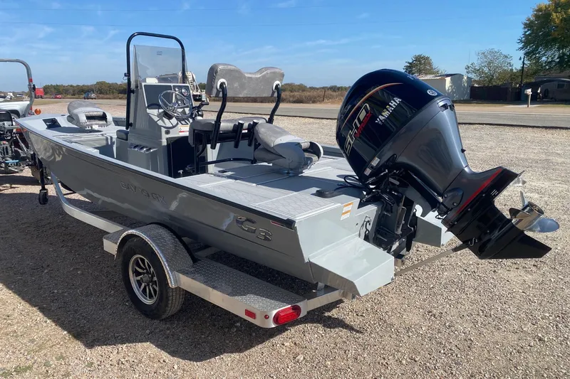 Slide: The Image of 2026 G3 Bay 19 GX boat with Yamaha outboard motor on trailer. - 12